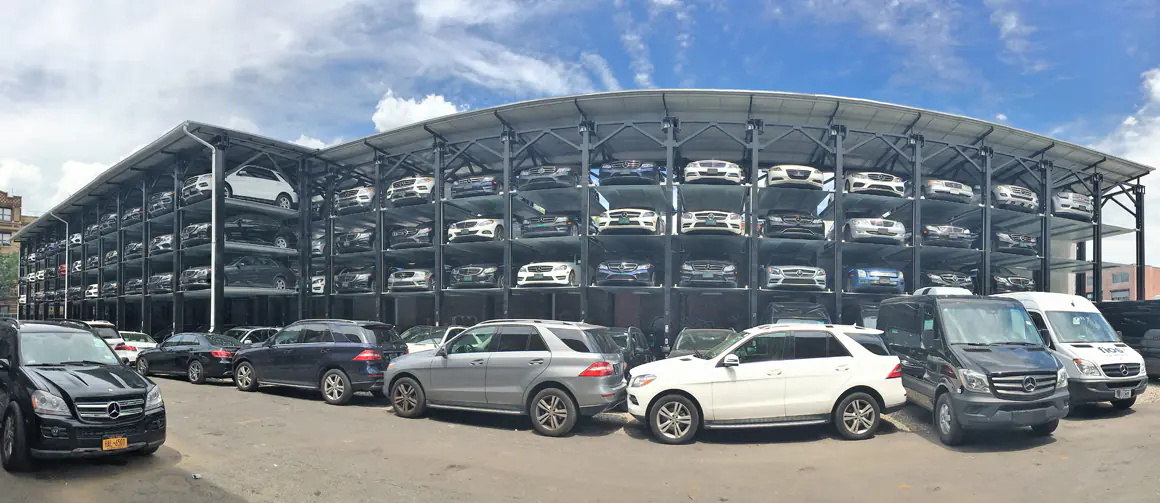 ParkPlus QP1000 quad stacker parking lift installed in a multi-level parking structure