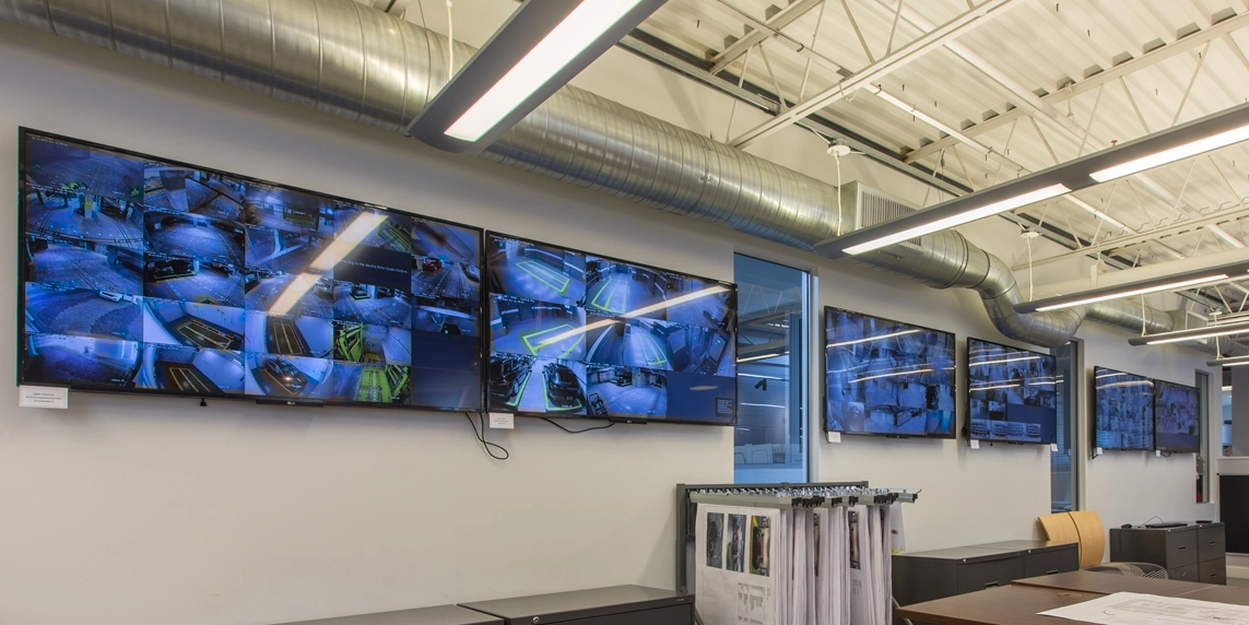 ParkPlus automated parking lift service technician monitoring systems in the 24/7 control room