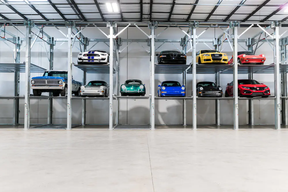 ParkPlus TP500 triple stacker parking lift installed in a commercial garage