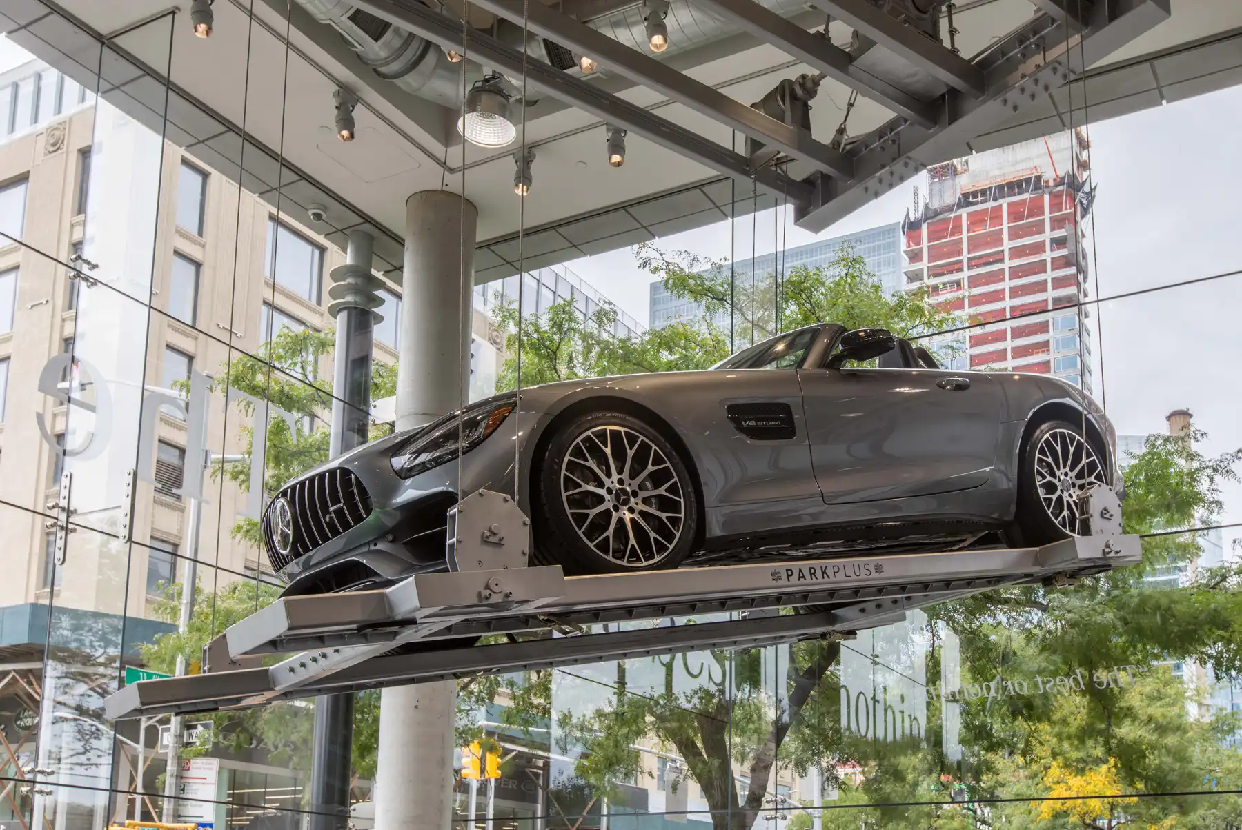 ParkPlus Suspended Lift Display Unit above the showroom floor at Mercedes-Benz Manhattan