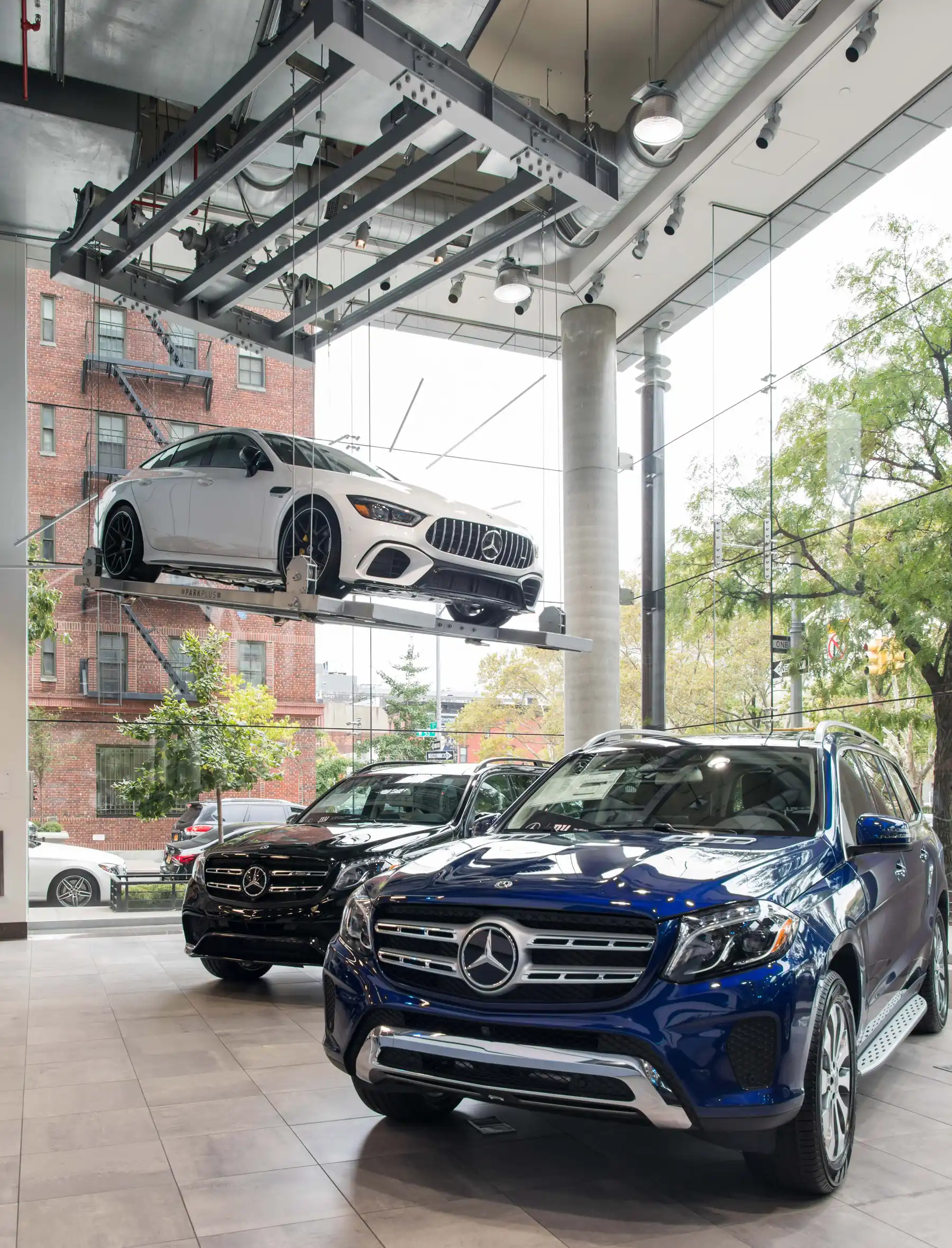 ParkPlus display lift showcasing Mercedes-Benz inventory above the showroom floor