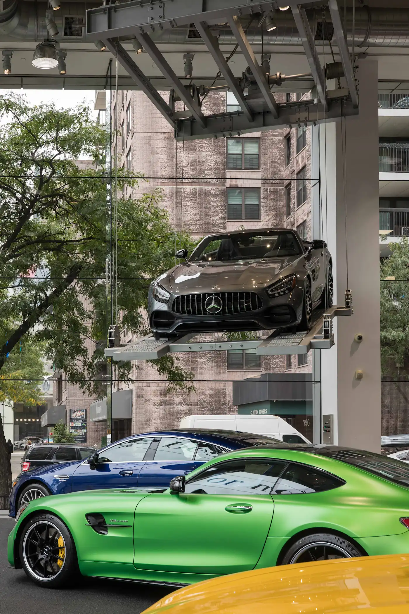 Vehicle elevated on ParkPlus display lift at Mercedes-Benz Manhattan showroom